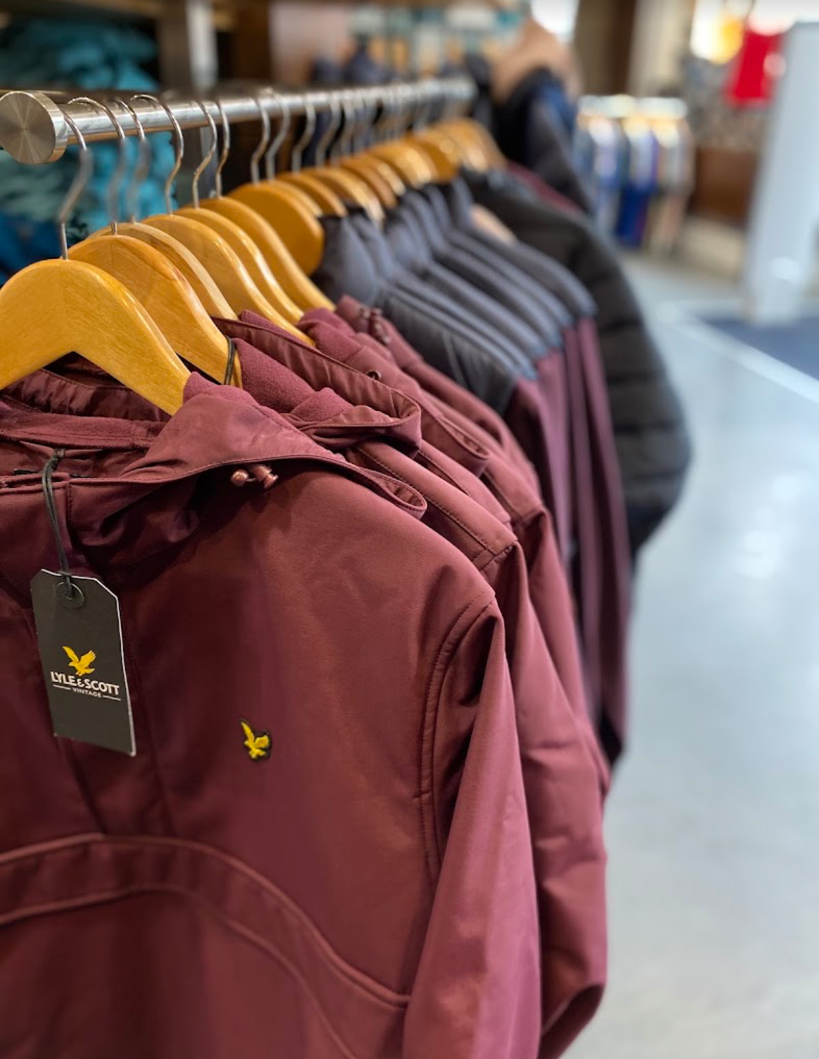 A rail of Lyle & Scott jackets and outerwear in store