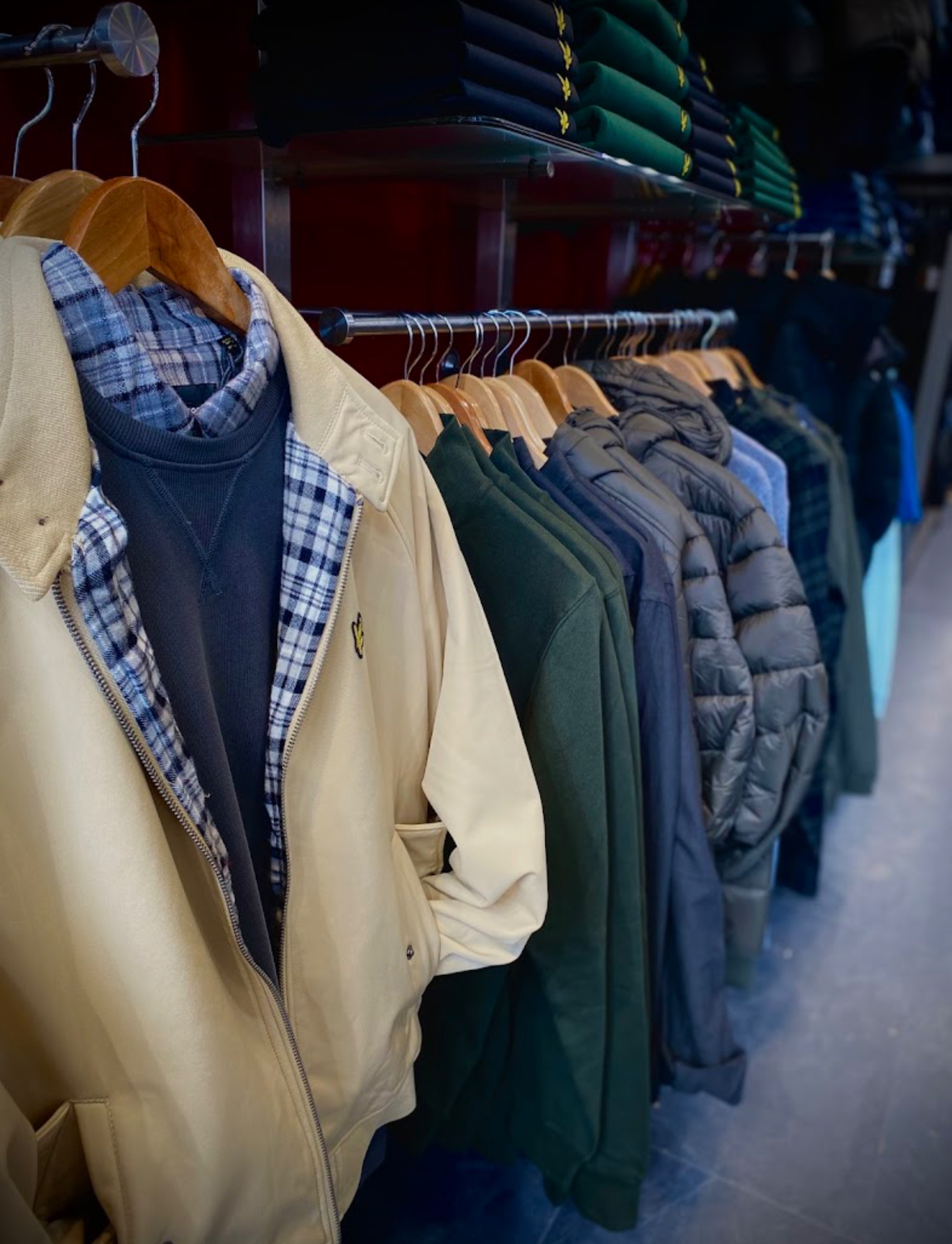 Casual jackets, sweatshirts and knitwear on the rails in store